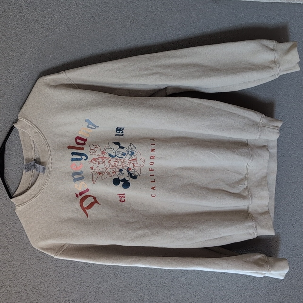 Disneyland's cream sweatshirt